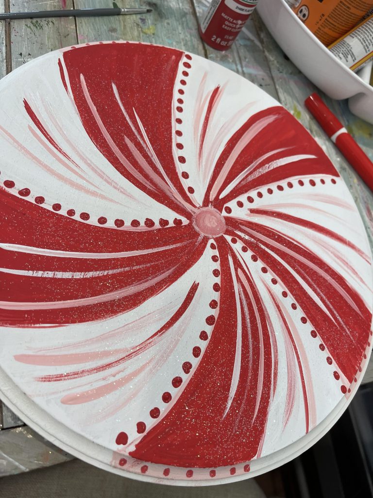 painting peppermint on wooden circle
