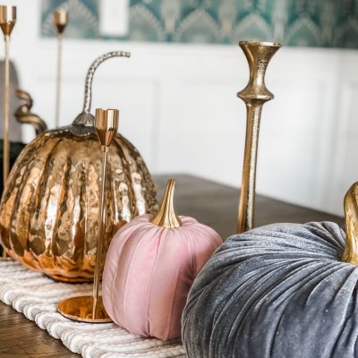 fall tablescape with pumpkins and candlesticks
