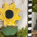 painted sunflower sign with burlap banner
