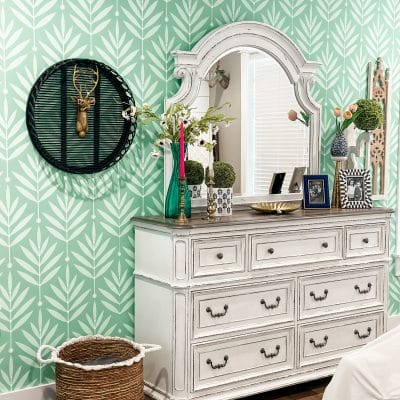 adding wallpaper to an accent wall in the master bedroom